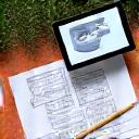 Sketchpad and tape measure on an outdoor patio, representing initial consultation.